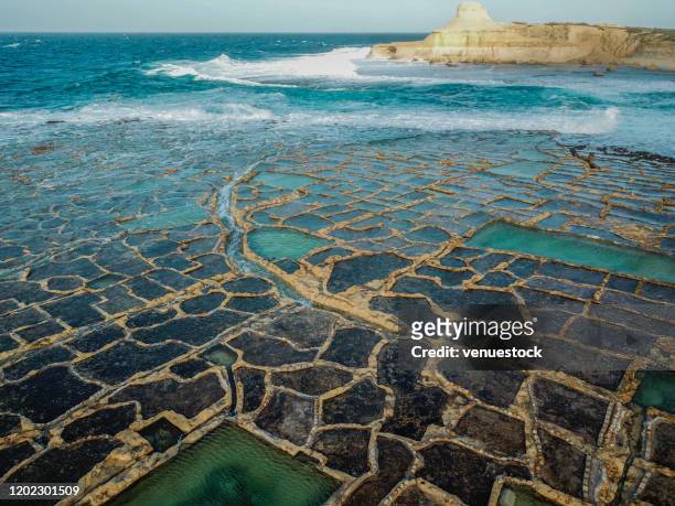 drone photo - salt pans of gozo, malta stock photo - malta aerial stock pictures, royalty-free photos & images