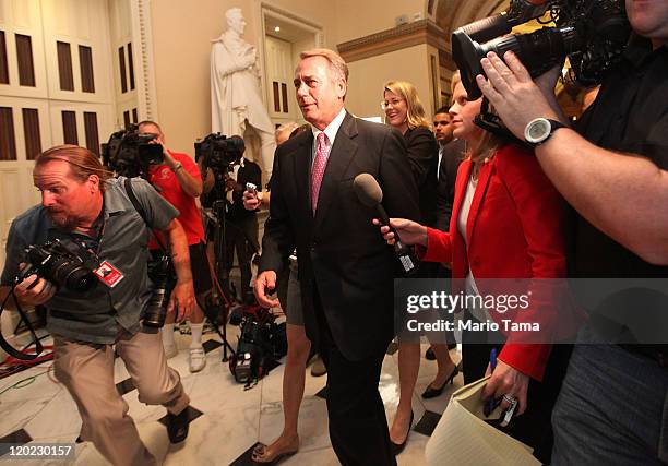 Speaker of the House John Boehner departs the House chamber after the House vote on the debt extension at the U.S. Capitol on August 1, 2011 in...