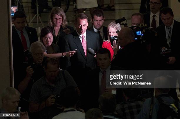 Speaker of the House John Boehner is surrounded by reporters after the House voted to raise the debt ceiling at the U.S. Capitol on August 1, 2011 in...