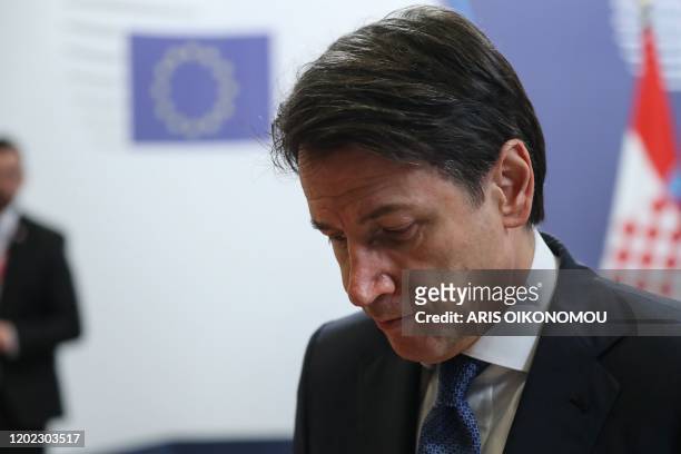 Italy's Prime Minister Giuseppe Conte leaves at the end of the special European Council summit in Brussels on February 21, 2020. - Time was called on...