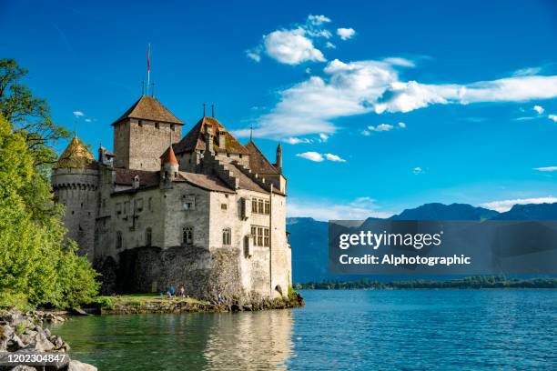 chateau de chillon on lake geneva, switzerland - montreux stock pictures, royalty-free photos & images