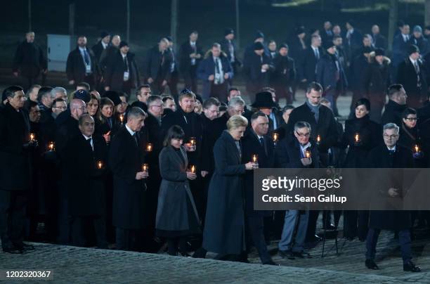 Polish President Andrzej Duda and Polish First Lady Agata Kornhauser-Duda lead official delegations to lay candles at the Auschwitz Memorial during...