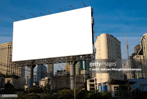 blank billboard at blue sky background - billboard highway stock pictures, royalty-free photos & images