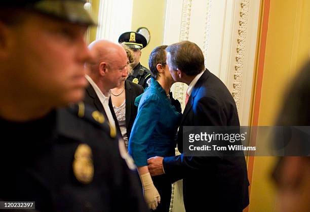 Rep. Gabrielle Giffords, D-Ariz., is greeted by Speaker John Boehner, R-Ohio, upon arriving to the Capitol with Rep. Debbie Wasserman Schultz,...