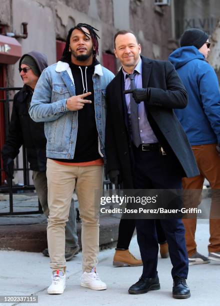 Player Patrick Chung and Donnie Wahlberg are seen on set of 'Blue Bloods' on February 21, 2020 in New York City.