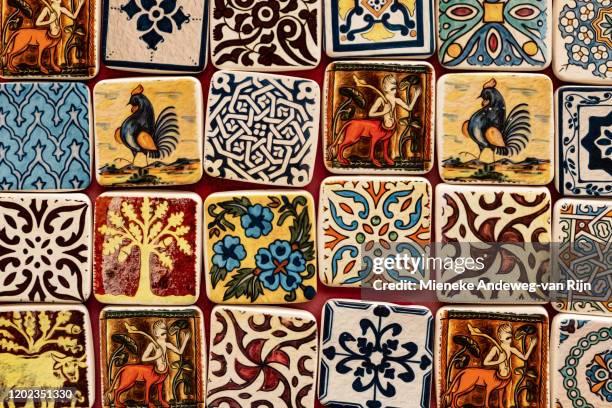 patterned ceramic fridge magnets for sale in erice, sicily, italy - guidebook stock pictures, royalty-free photos & images