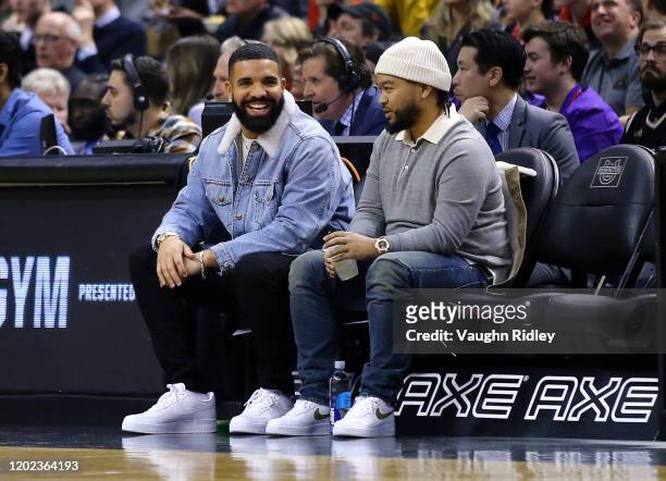 Singer Drake looks on from his court side seats during the first half of an NBA game between the Phoenix Suns and the Toronto Raptors at Scotiabank...