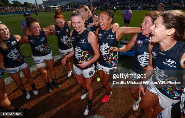 Blues players sing the team song during the 2020 AFLW Round 03 match between the Western Bulldogs and the Carlton Blues at VU Whitten Oval on...