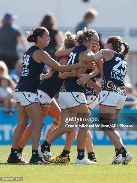 Nicola Stevens of the Blues celebrates a goal with teammates during the 2020 AFLW Round 03 match between the Western Bulldogs and the Carlton Blues...