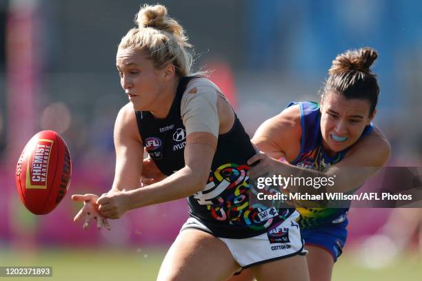 Jess Hosking of the Blues is tackled by Bonnie Toogood of the Bulldogs during the 2020 AFLW Round 03 match between the Western Bulldogs and the...