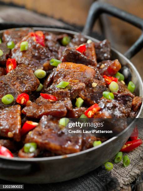 sticky, bourbon and honey glazed pork belly bites - glazen pot stock pictures, royalty-free photos & images