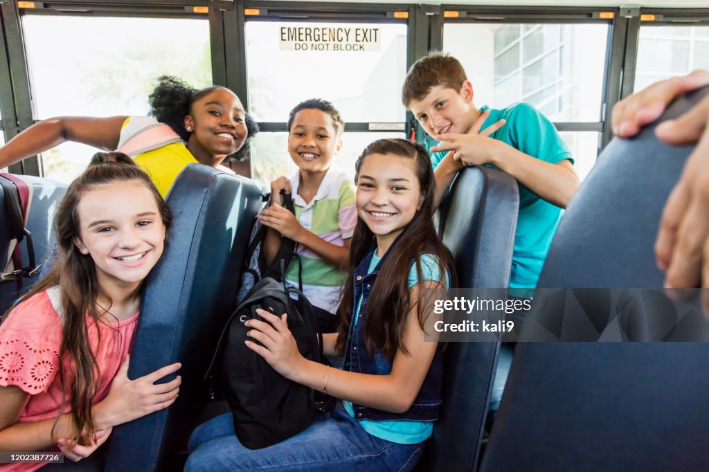 Multiethnic Junior High Students Riding School Bus High-Res Stock Photo ...