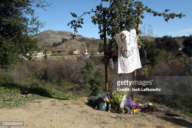 Makeshift memorial is shown near the site of the helicopter crash that yesterday claimed the lives of NBA great Kobe Bryant, his daughter Gianna and...