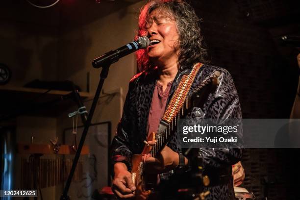 asean senior man performs hot live stage with electric guitar and vocal - blues music stock-fotos und bilder