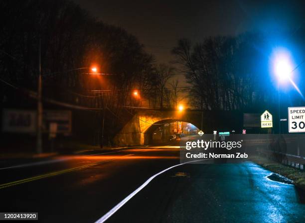 street scene  (wet roadway in the rain, night) - washington dc street stock pictures, royalty-free photos & images