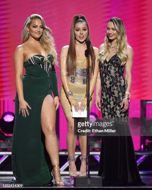 Adult film actress/director Alexis Texas and adult film actresses Vanna Bardot and Naomi Swann present an award during the 2020 Adult Video News...