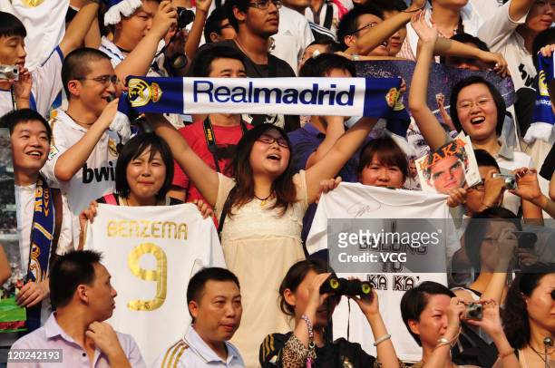 Real Madrid fans watch from the stand during a training session at Tianhe Sports Center on August 1, 2011 in Guangzhou, China.