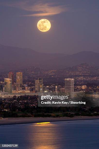 full moon rising over downtown san diego - downtown san diego stock pictures, royalty-free photos & images