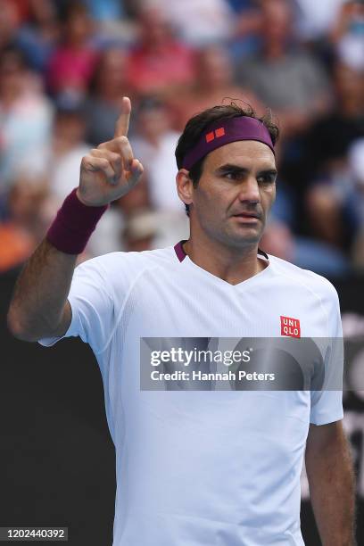 Roger Federer of Switzerland celebrates after winning the fourth set during his Men’s Singles Quarterfinal match against Tennys Sandgren of the...