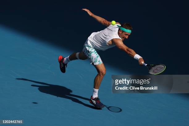 Tennys Sandgren of the United States plays a backhand during his Men’s Singles Quarterfinal match against Roger Federer of Switzerland on day nine of...