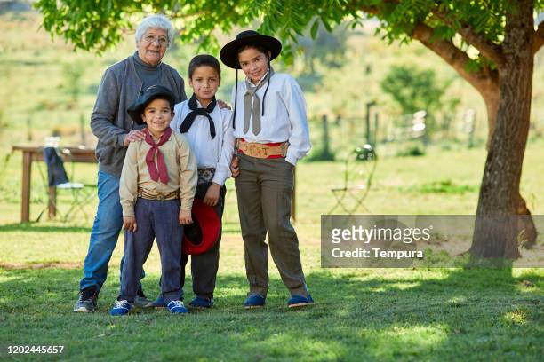 grandmother with grandsons portrait - gaucho argentina stock pictures, royalty-free photos & images