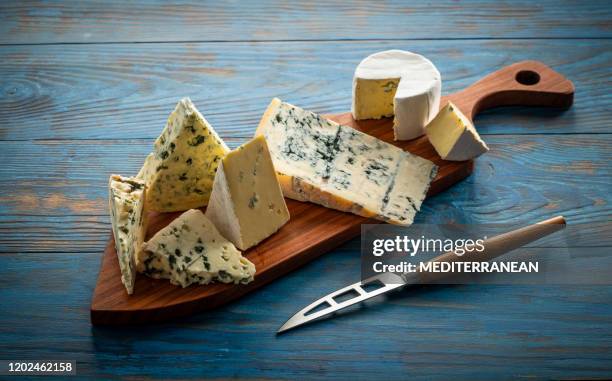 blue cheese cutting board with knife - roquefort cheese stock pictures, royalty-free photos & images