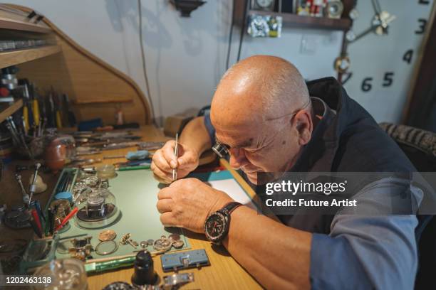 Man Fixing Clock Old Man Fixing Clock Photos and Premium High Res Pictures - Getty Images