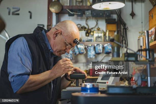 Man Fixing Clock Old Man Fixing Clock Photos and Premium High Res Pictures - Getty Images
