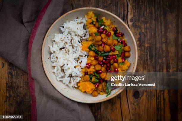 bowl of sweet potato lentil curry with basmati rice - curry bildbanksfoton och bilder