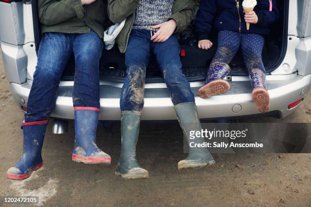 childrens wellington boots - dirty car fotografías e imágenes de stock