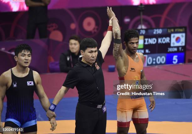 Indian Wrestler Naveen in a 70kg category bout against Taejin Jeon during the Senior Asian Wrestling Championship, at IGI Stadium, on February 22,...