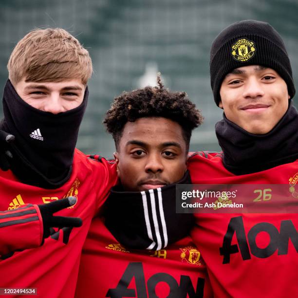 Brandon Williams, Angel Gomes and Mason Greenwood of Manchester United in action during a first team training session at Aon Training Complex on...