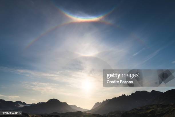 corona, sun dog and double halo in east greenland - sundog stock pictures, royalty-free photos & images