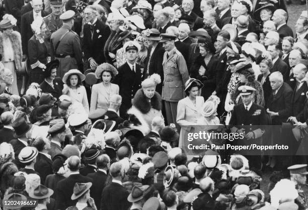 Lieutenant Philip Mountbatten joins the royal family including, from right, King George VI, Queen Elizabeth, Princess Margaret, Queen Mary of Teck,...