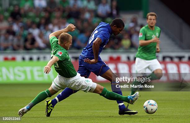 Andreas Wolf of Bremen and Jermaine Beckford of Everton battle for the ball during the pre season friendly match between SV Werder Bremen and Everton...