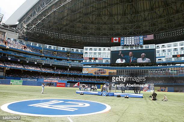 Hall of Famer Roberto Alomar speaks during a ceremony to retire his during MLB action between the Texas Rangers and the Toronto Blue Jays at the...