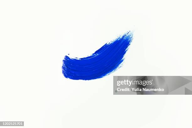 blue smear of creamy eye shadow on a white background. creamy texture of blue eye shadow isolated on white. - smudged stock pictures, royalty-free photos & images