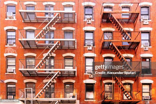 fire escape ladders on residential buildings in east village, new york city, usa - the soho house stock pictures, royalty-free photos & images