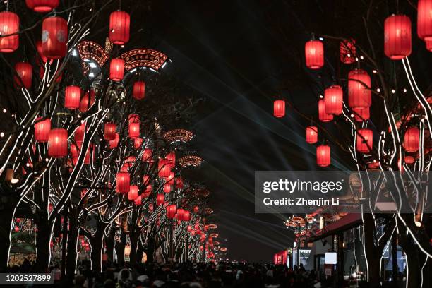 chinese spring festival crowds with red lanterns at night / xi'an, china - chinese new year 2020 stock pictures, royalty-free photos & images