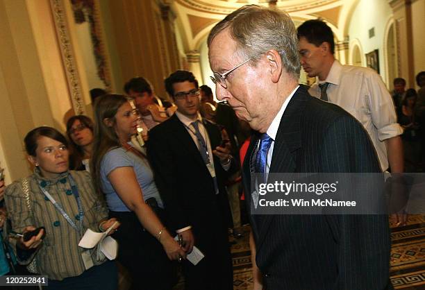 Senate Minority Leader Sen. Mitch McConnell returns to his office after the Senate voted on the debt limit bill at the U.S. Capitol on August 2, 2011...