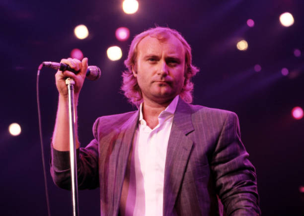 English drummer, singer, songwriter, and former member of the rock band Genesis, Phil Collins performs onstage at the Joe Louis Arena during the...