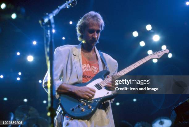 English guitarist, songwriter, and singer who co-founded the rock band Genesis, Mike Rutherford performs onstage at the Joe Louis Arena during the...