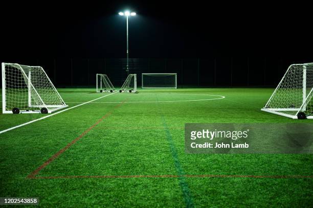 generic 4g astroturf football training pitch with portable goals. - soccer field empty night imagens e fotografias de stock