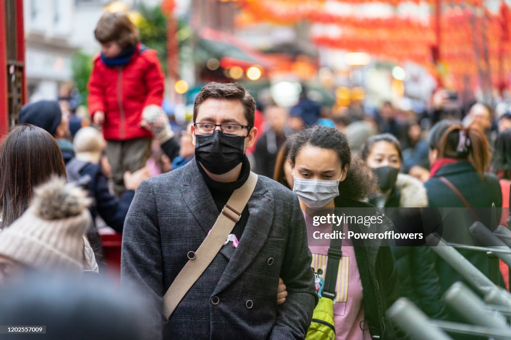 People wearing a face masks to protecting themself because of epidemic in China. Selective Focus. Concept of coronavirus quarantine.