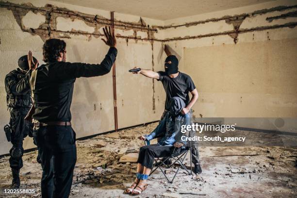 detective saving a hostage - kidnapping stock pictures, royalty-free photos & images