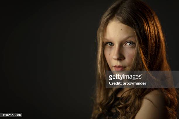teenage girl potrait on black background - latvia girls stock pictures, royalty-free photos & images