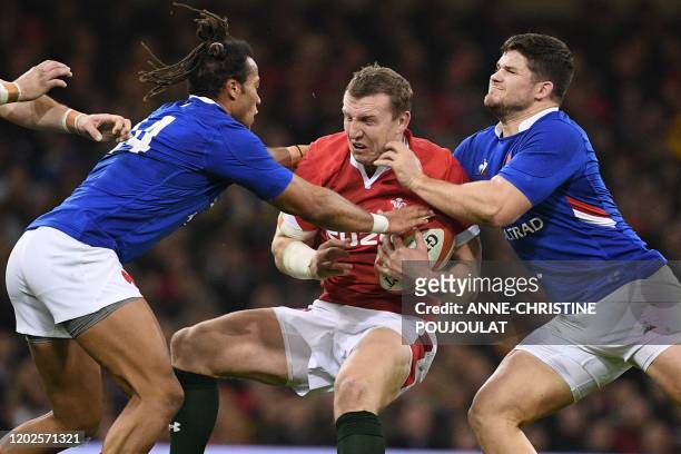 Wales' centre Hadleigh Parkes is tackled during the Six Nations international rugby union match between Wales and France at the Principality Stadium...