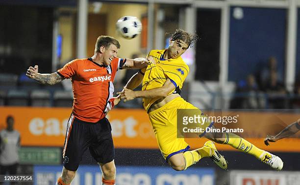 Gabriel Paletta of Parma battles for the ball in the air with Dean Beckwith of Luton Town during a pre season friendly match between Luton Town and...