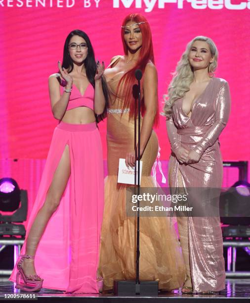 Adult film actresses Alex Coal, Nicolette Shea and Violet Doll present an award during the 2020 Adult Video News Awards at The Joint inside the Hard...