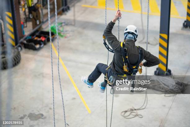 dangerous work - rope access technician stock pictures, royalty-free photos & images
